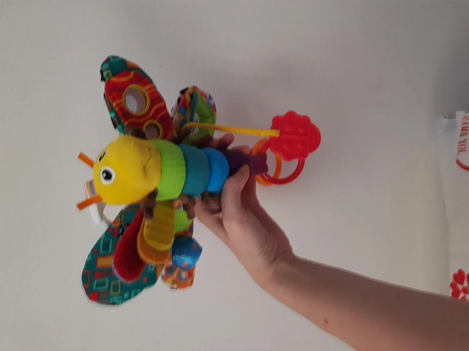 Tomy Lamaze Flip Flap Dragon peluche éveil naissance